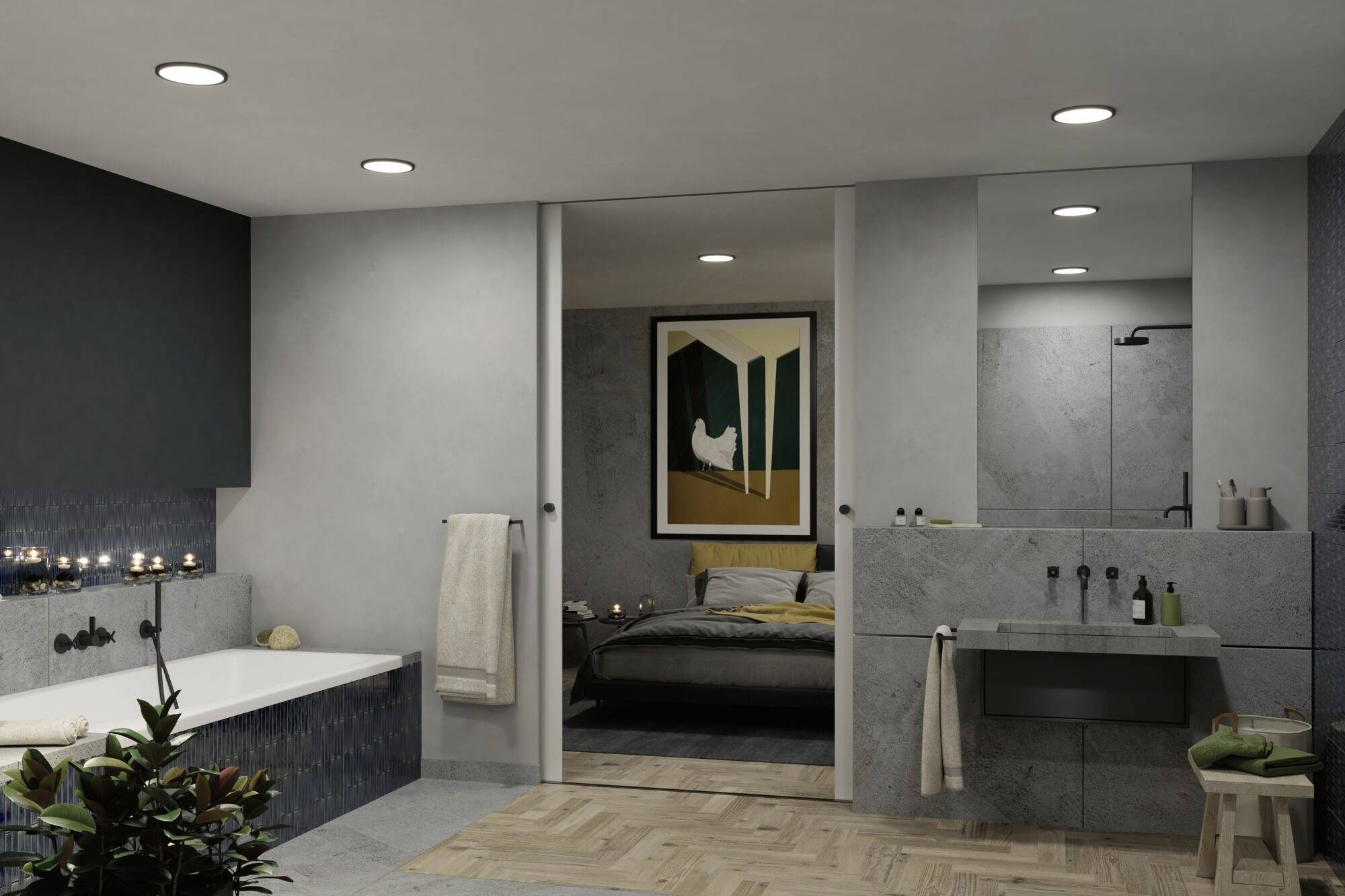 Modernes Badezimmer mit großer Badewanne, grauen Fliesen und indirekter Beleuchtung. Durch eine Schiebetür Blick ins Schlafzimmer.