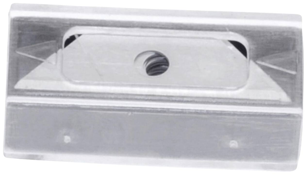 Ein silberner Bleistiftspitzer aus Metall mit einem einzelnen Loch für den Bleistift, abgebildet von oben.