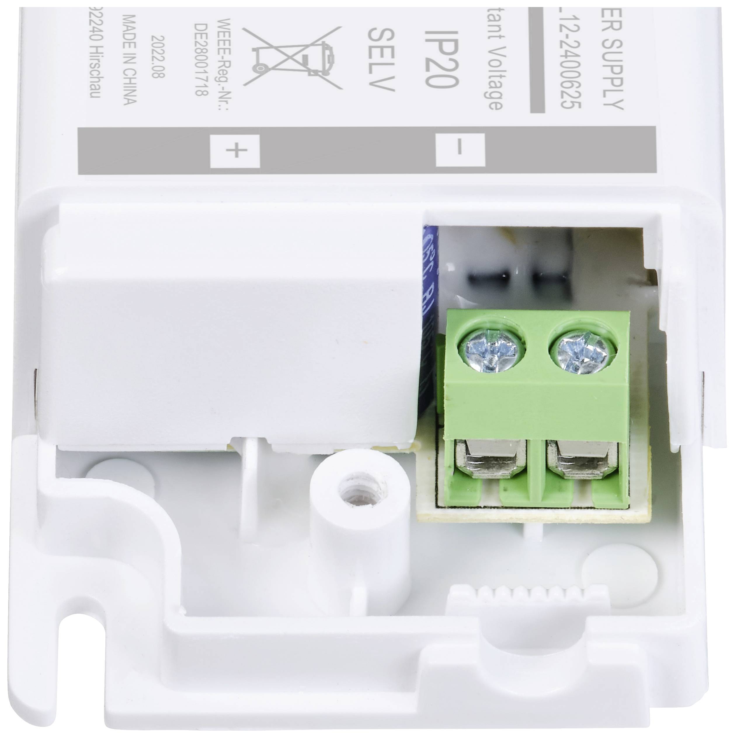 Weißes Plastikgehäuse eines LED-Trafos, zeigt Anschlüsse und Beschriftung '12-24VDC', IP20, für Innenanwendungen geeignet.