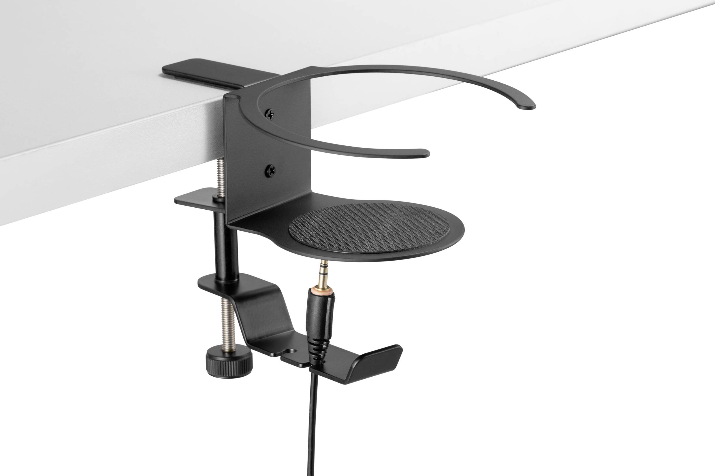 Schwarzer Kopfhörerhalter, der an einem Tisch befestigt ist, mit runder Ablagefläche und Klemmbefestigung an der Tischkante.