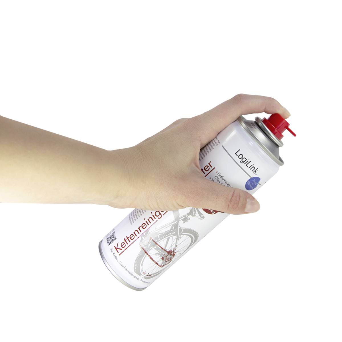 Hand hält eine Sprühdose Kettenreiniger. Die Dose ist weiß mit rotem Sprayknopf, Nahe einer Fahrradabbildung.