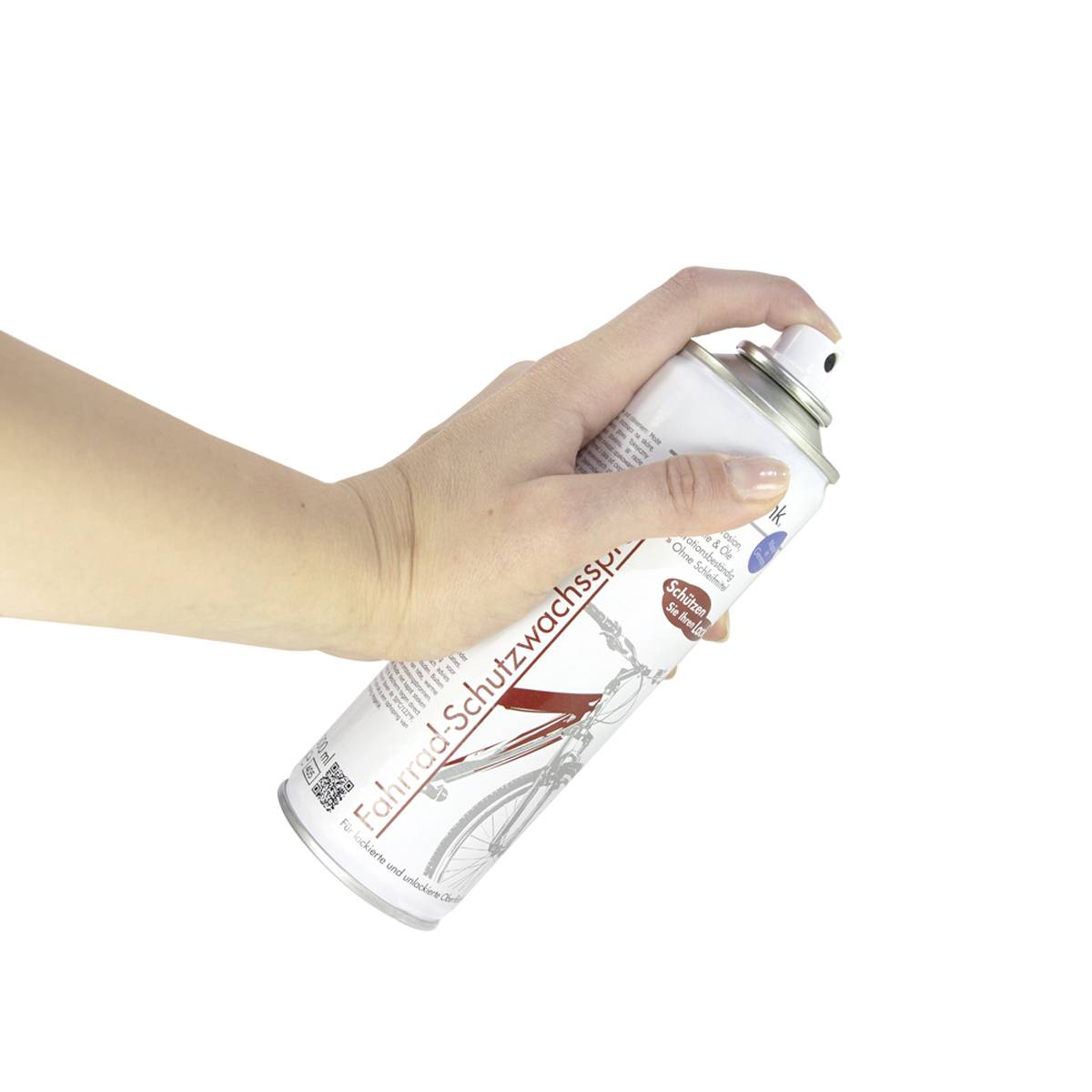 Hand hält eine Sprühdose mit der Aufschrift 'Fahrrad-Schutzwachs', für die Pflege und den Schutz von Fahrrädern.
