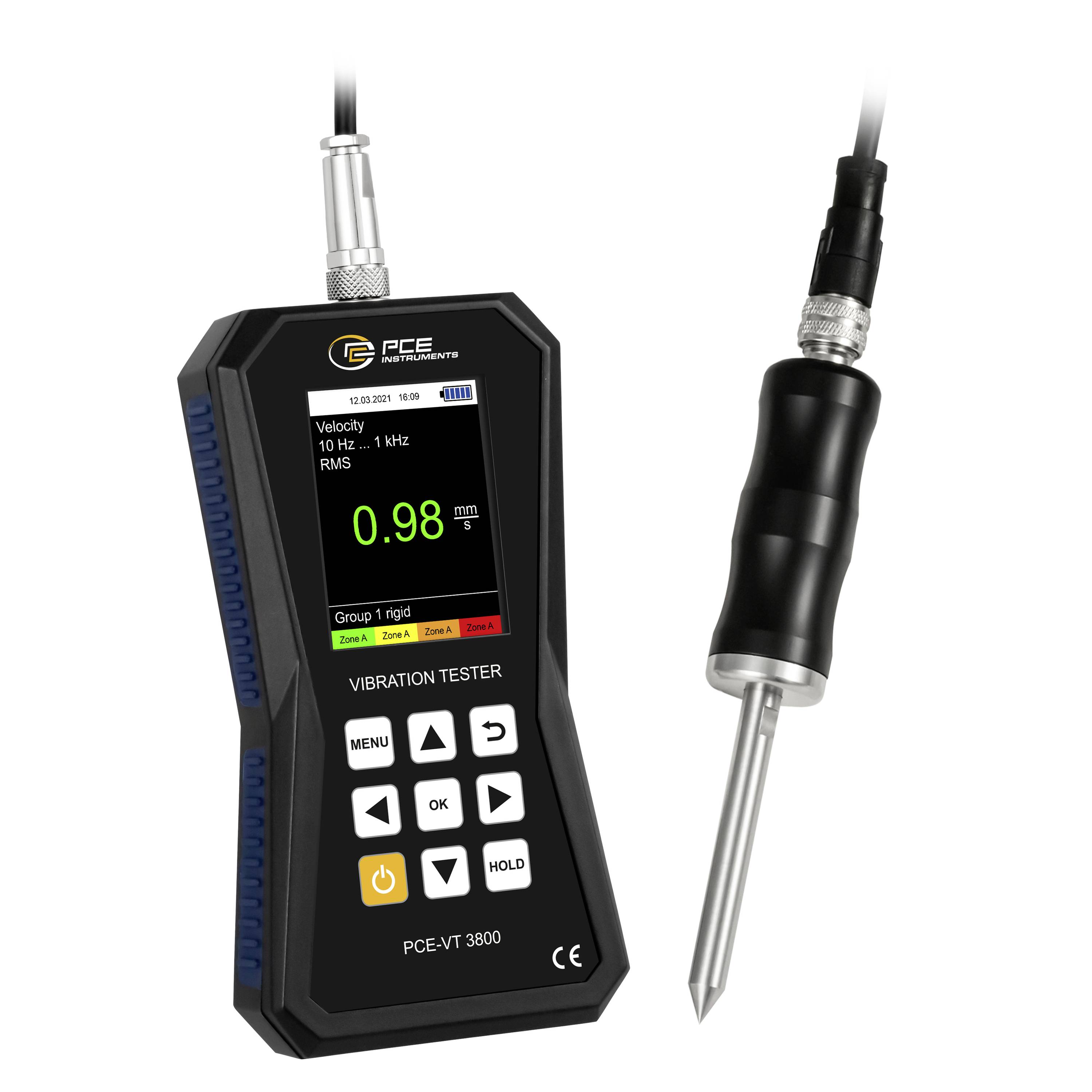 Tragbarer Vibrationsprüfer mit Sondendisplay, das 0,98 mm/s RMS anzeigt, und farbigen Zonenmarkierungen.