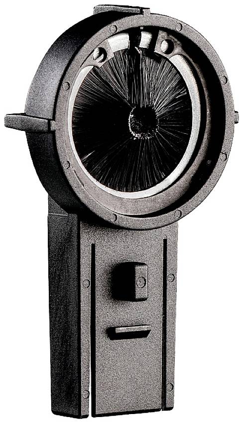 Eine runde Bürste in einem Gehäuse, montiert auf einem rechteckigen Sockel.