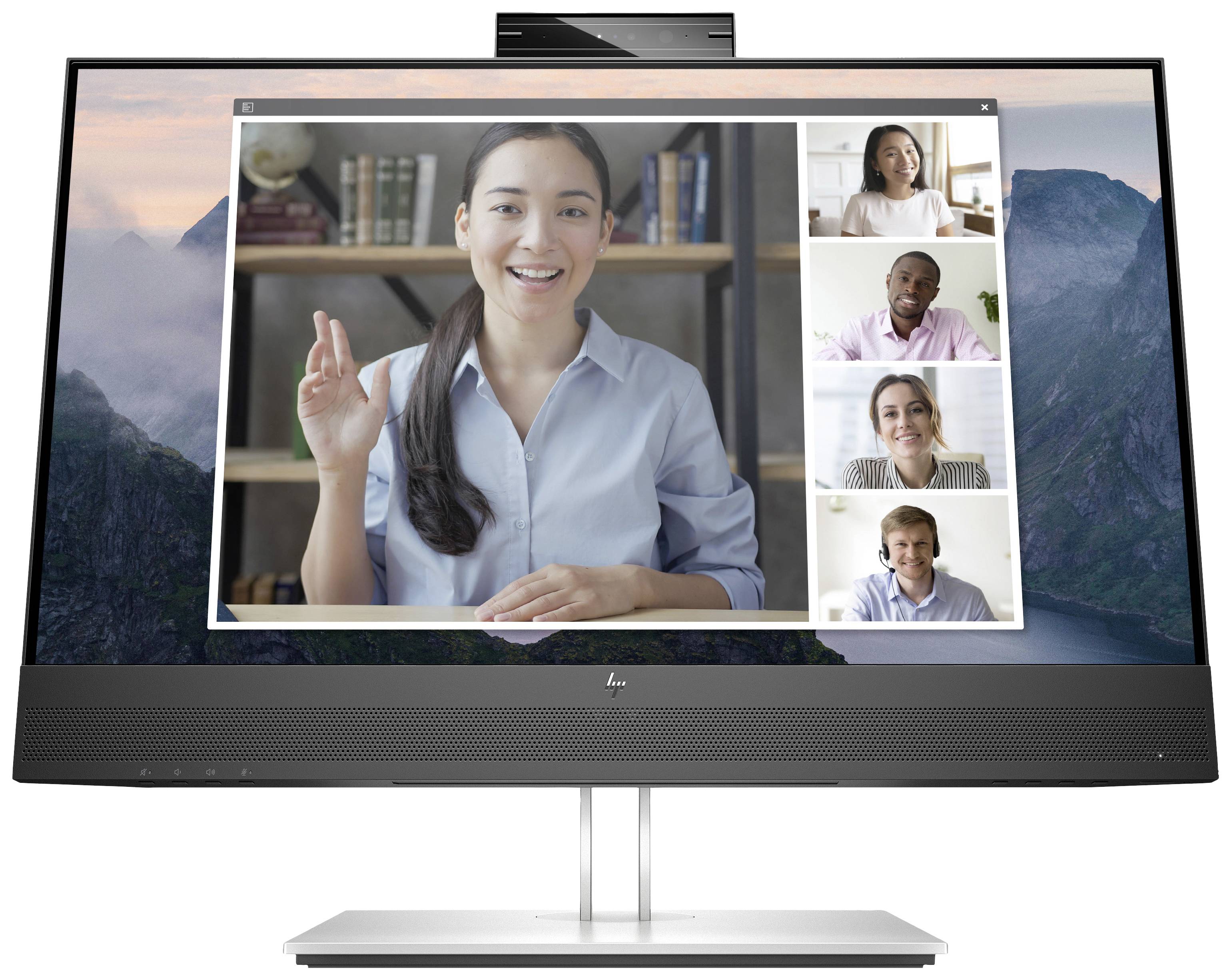 Ein Laptop-Bildschirm zeigt ein Videoanruf-Meeting mit fünf Personen, die lächelnd in die Kamera schauen. Im Hintergrund sind Bücherregale.