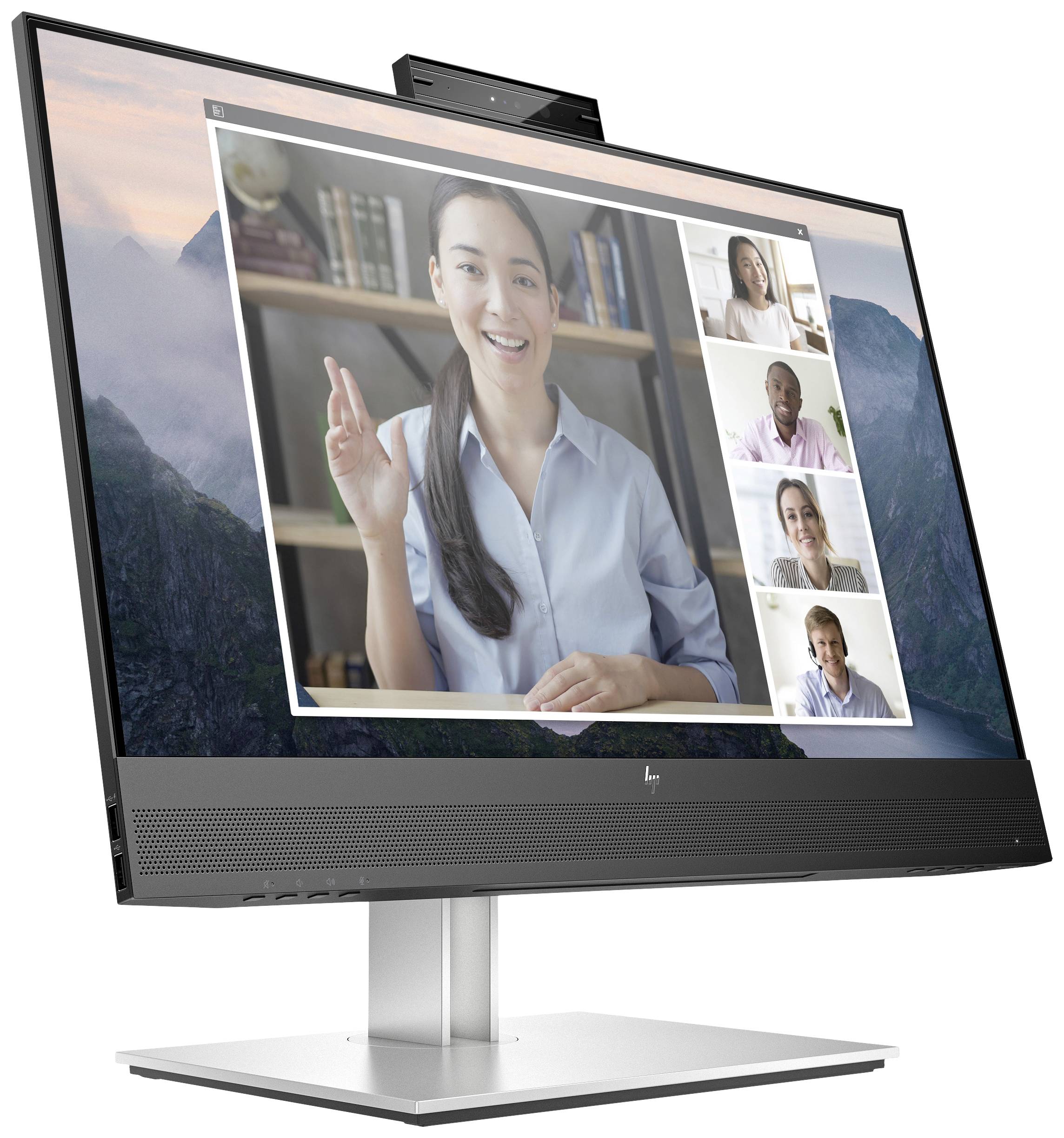 Eine Videokonferenz auf einem Monitor zeigt eine Frau, die spricht, und vier Teilnehmer, die zuhören. Teilnehmer lächeln und scheinen zu kommunizieren.