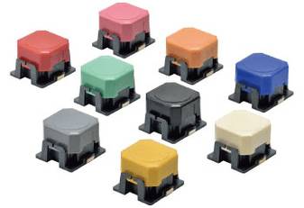 Neun mechanische Tastenschalter in verschiedenen Farben (Rot, Orange, Blau, Grün, Schwarz, Grau, Gelb, Creme) auf weißem Hintergrund.