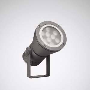 Ein grauer LED-Strahler mit rundem Gehäuse und Standhalterung zeigt nach oben.