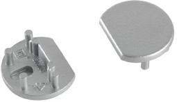 Ein silbernes, halbrundes Metallobjekt mit zwei Zapfen auf der Unterseite, vermutlich ein Maschinen- oder Gerätebauteil.