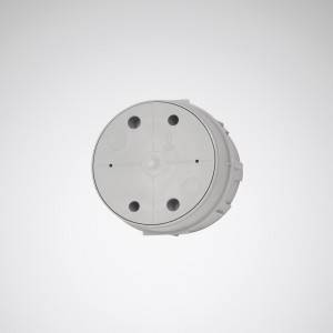 Rundes weißes Gehäuse mit vier sichtbaren Schrauben, vermutlich für elektronische Geräte.