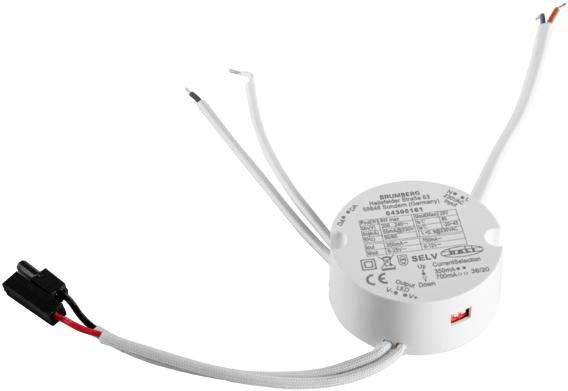 Ein runder, weißer elektrischer Transformator mit Kabeln, die an beiden Seiten herausragen. Aufdruck zeigt technische Spezifikationen.