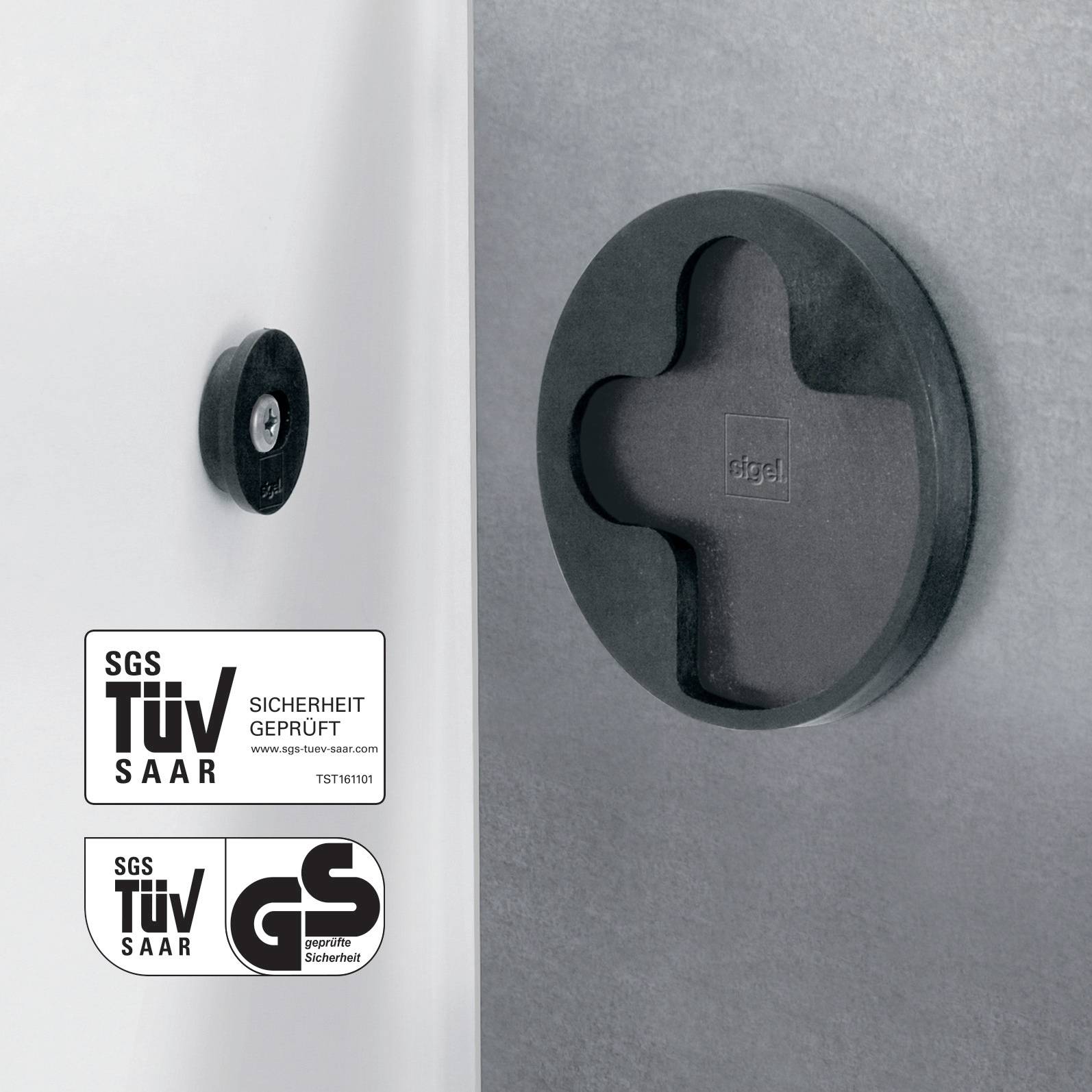 Runde schwarze Sicherheitsverriegelung auf silbernem Metallhintergrund; TÜV-Zertifikat unten links.