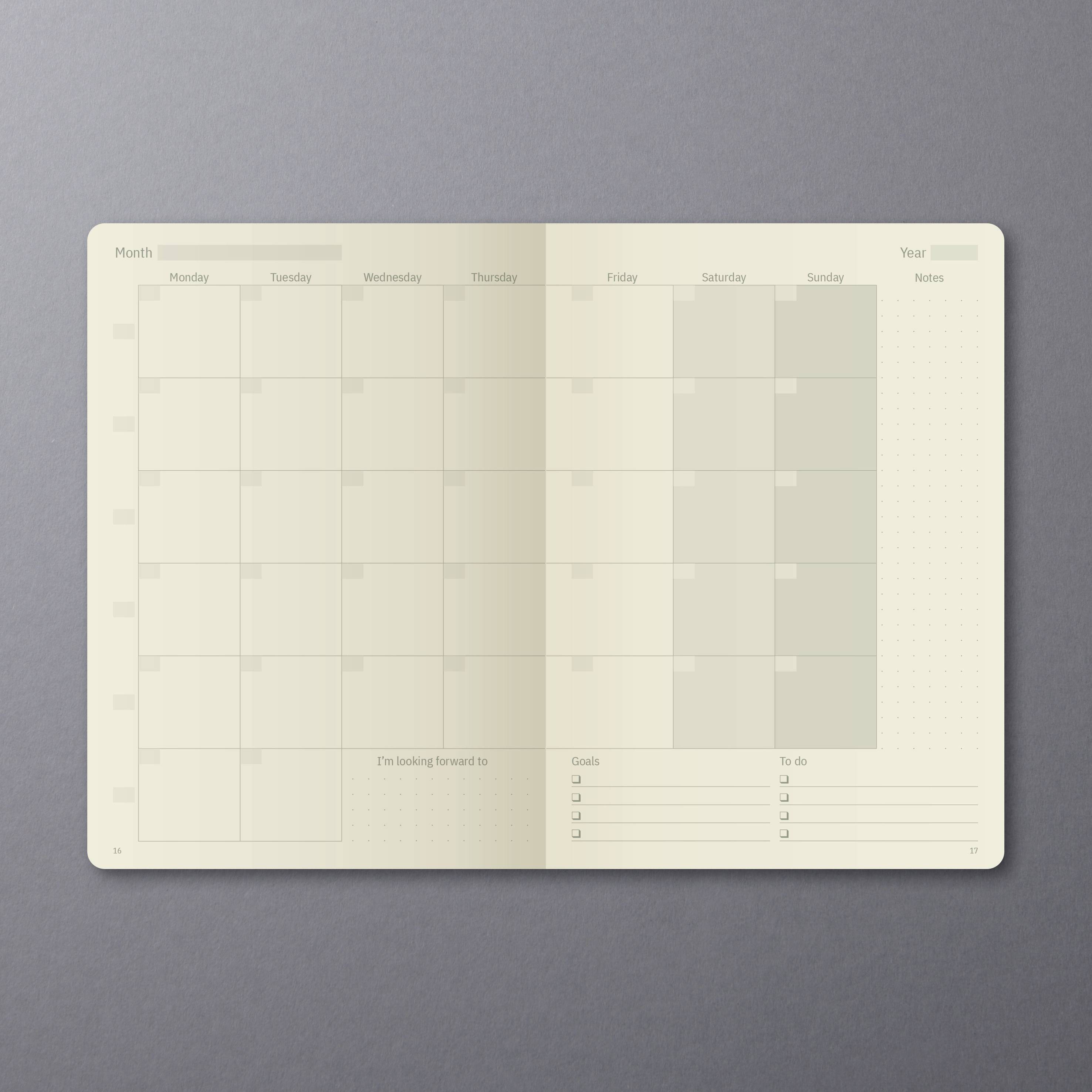 Leerer Monatskalender auf grauem Hintergrund, Wochenbeginn Montag, mit Bereichen für 'Ziele', 'To-do' und Notizen am Rand.