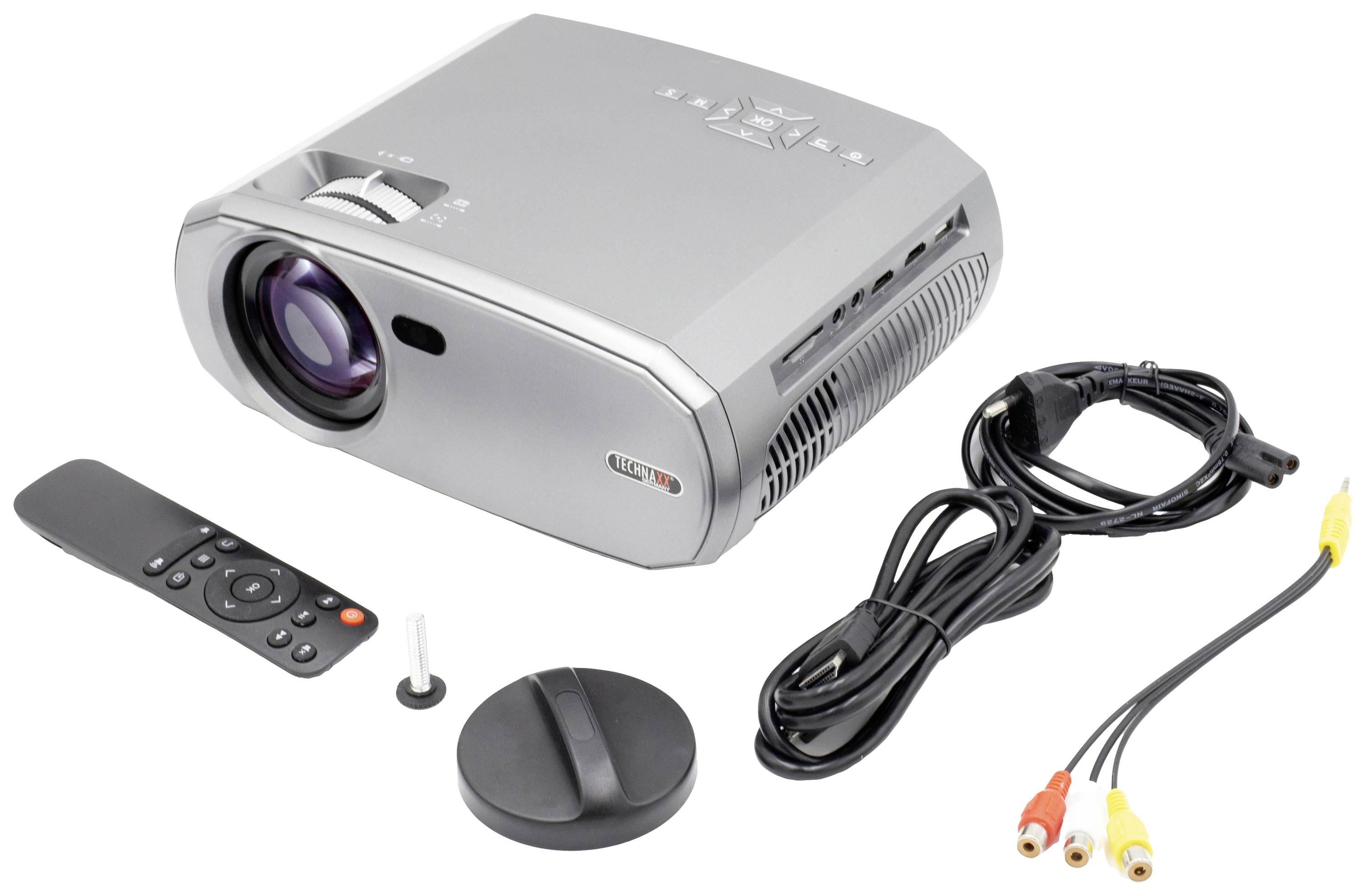 Ein silberner Projektor mit Fernbedienung, Stromkabel, Videokabel und Ständeraufsatz auf weißem Hintergrund.