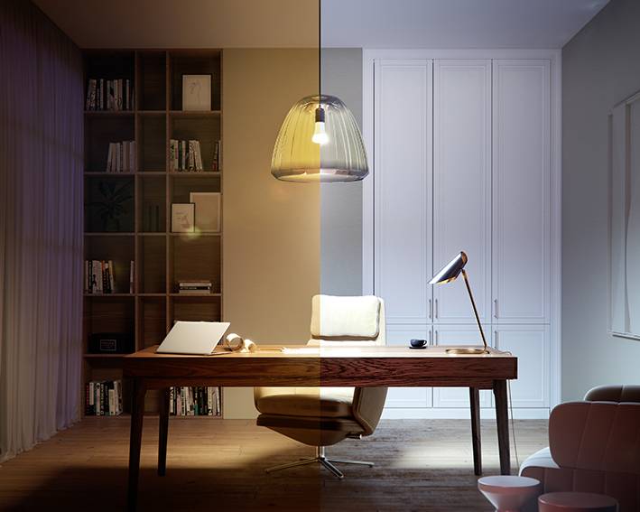 Das Bild zeigt ein modernes Arbeitszimmer, geteilt in zwei Hälften mit unterschiedlicher Beleuchtung: links warm, rechts kühl. Ein Schreibtisch mit Lampe und Sessel ist zentral platziert.