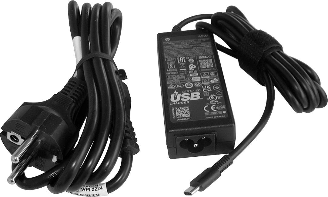Ein Netzteil mit zwei Kabeln, eines mit einem europäischen Stecker und das andere mit einem USB-C-Stecker, liegt nebeneinander.