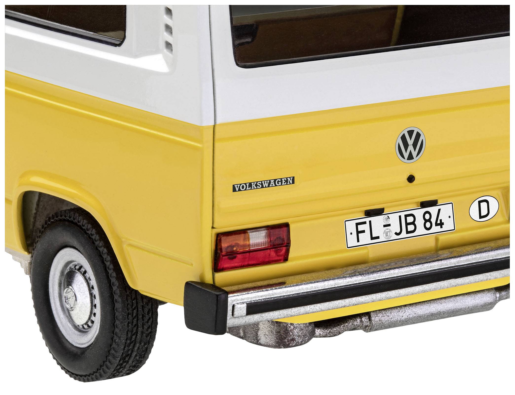 Gelbes und weißes Modellauto, Heckansicht mit 'Volkswagen'-Logo und Nummernschild 'FL JB 84'. Zeigt Details der Fahrzeugrückseite.