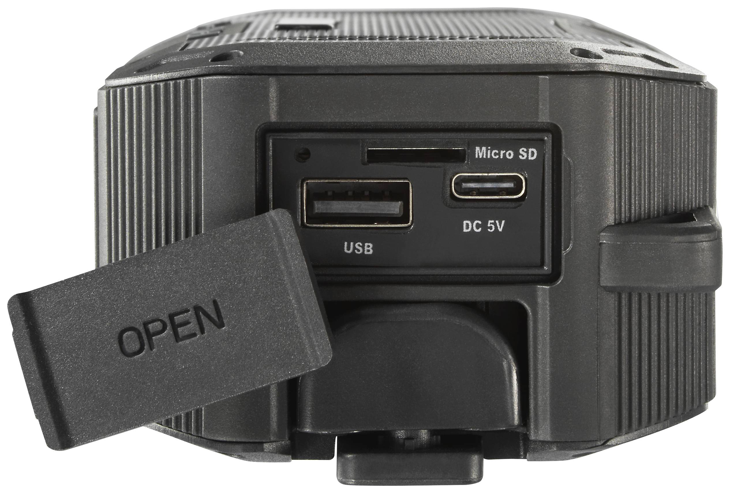 Rückansicht einer Kamera mit offenem Anschlussfach. Sichtbare Anschlüsse: USB, Micro SD und DC 5V. Abdeckung mit Aufschrift 'OPEN'.