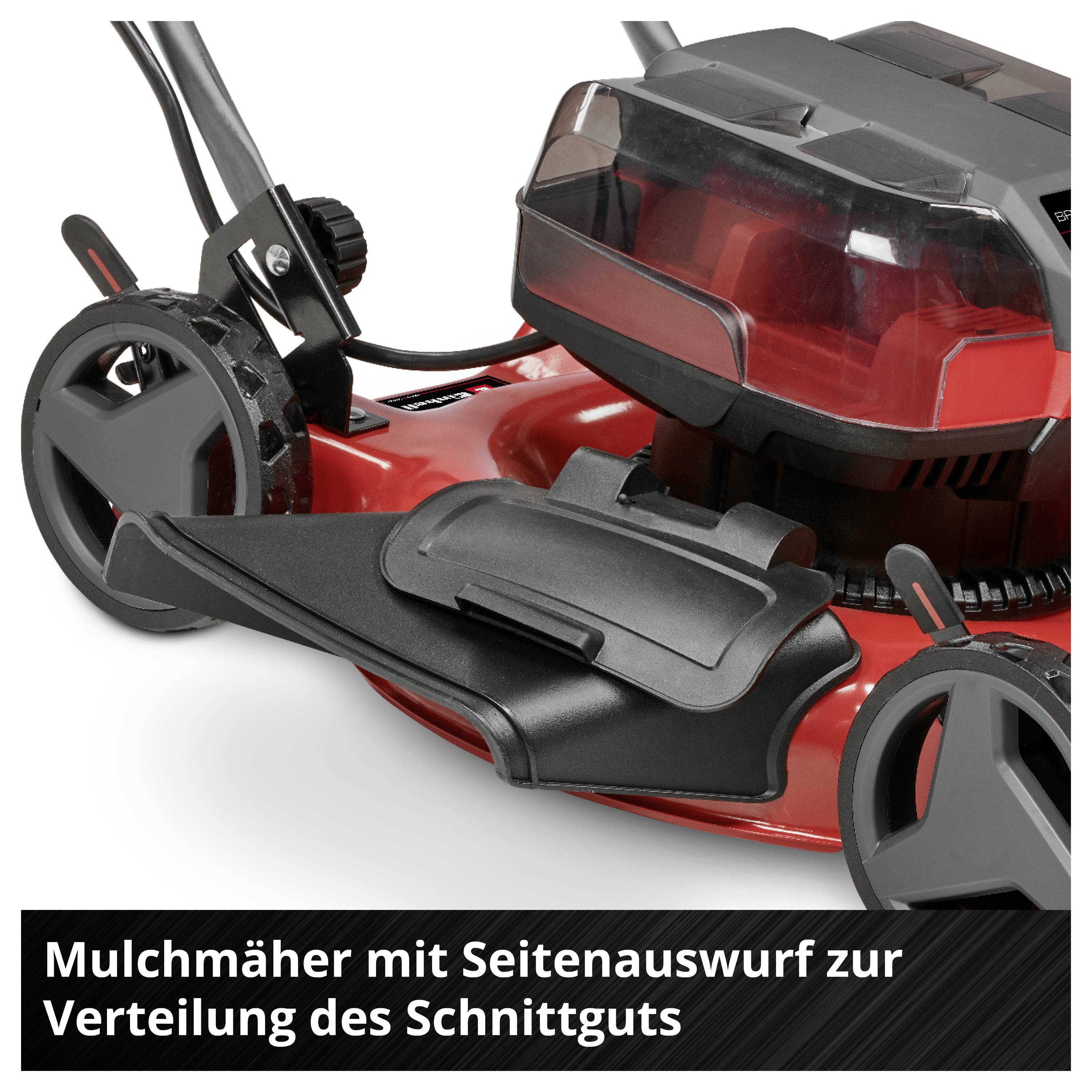Roter Mulchmäher mit Seitenauswurf; verteilt das Schnittgut.