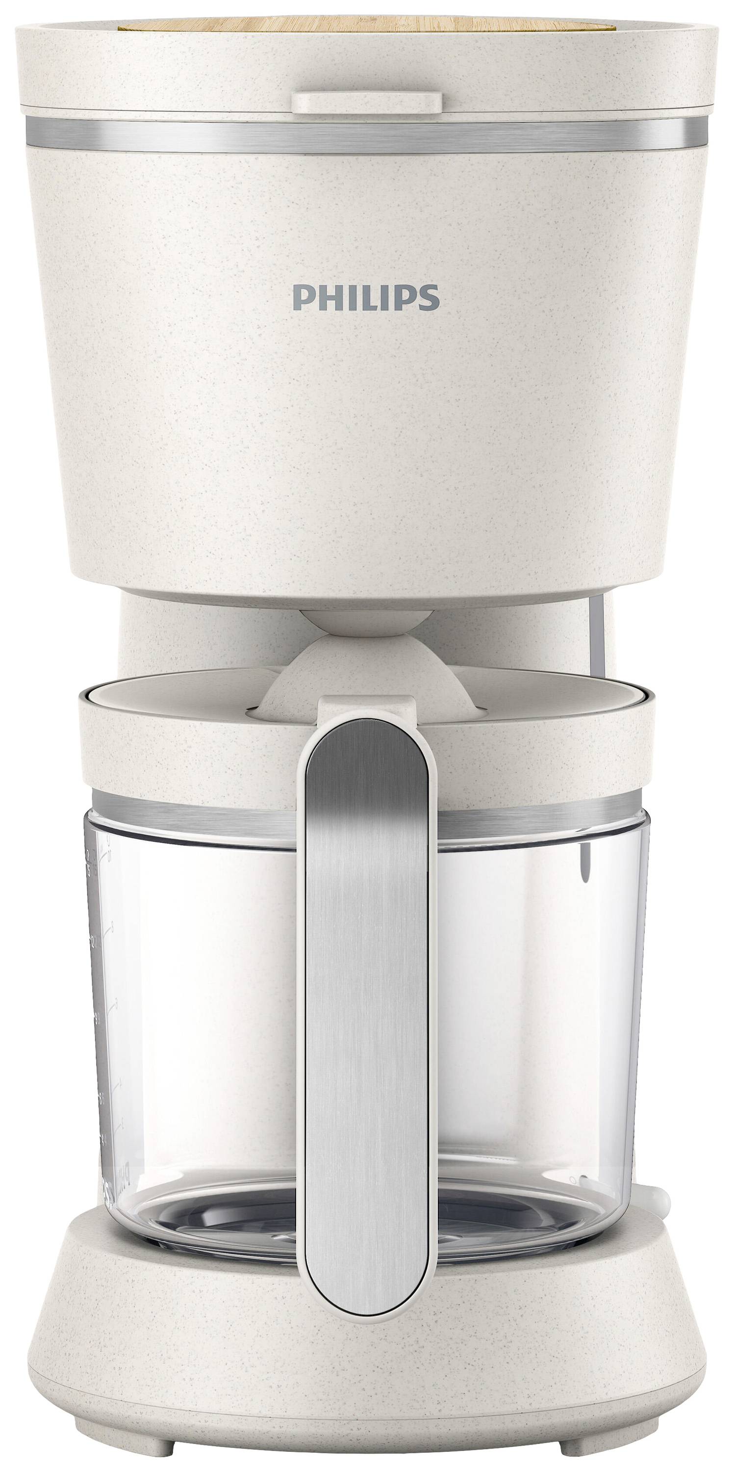Eine weiße Kaffeemaschine mit Glaskanne und silbernem Griff. Oben ist das 'Philips'-Logo. Ideal für die Zubereitung von Filterkaffee.