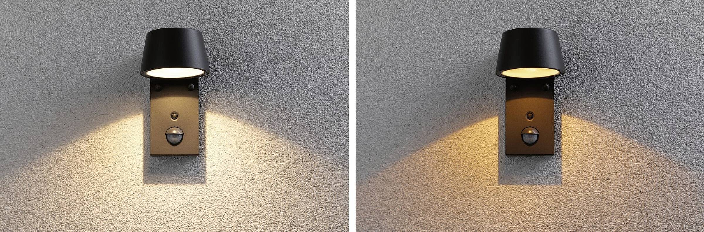 Zwei moderne, schwarze Außenwandleuchten an einer Wand, die helles, warmes Licht nach unten strahlen. Geeignet für stilvolle Außenbeleuchtung.