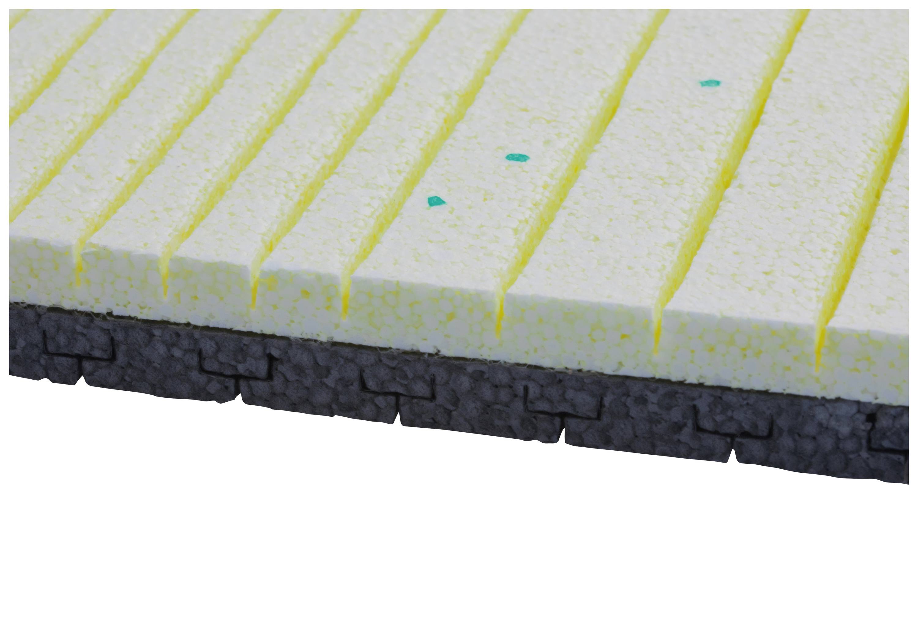 Schaumstoffplatte mit gelbem Kern und grauer Unterseite, oben mit gelben Linien strukturiert, für Dämmung oder Polsterung geeignet.