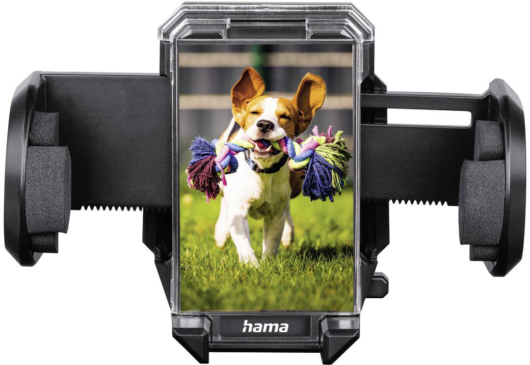Ein Smartphone-Halter zeigt ein Foto eines fröhlichen Hundes, der mit einem bunten Spielzeug über eine Wiese läuft.