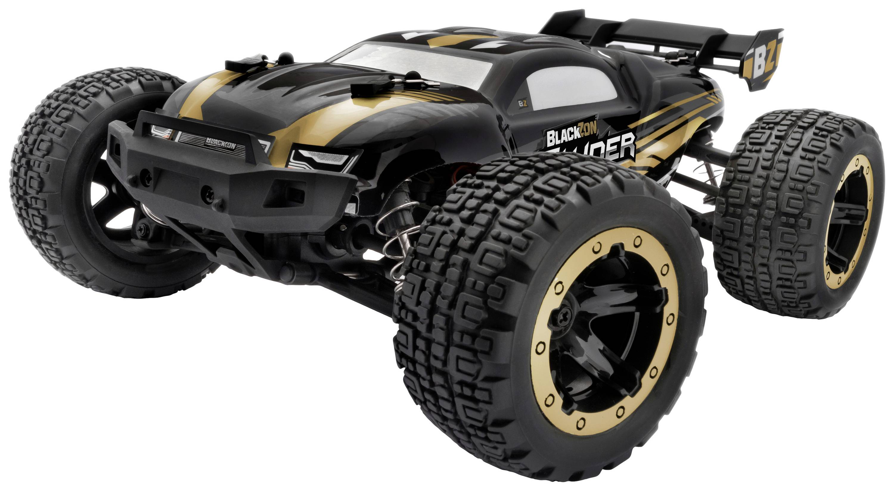 Ein ferngesteuertes, schwarzes Auto mit goldenen Akzenten und großen Reifen, geeignet für Offroad-Rennen.