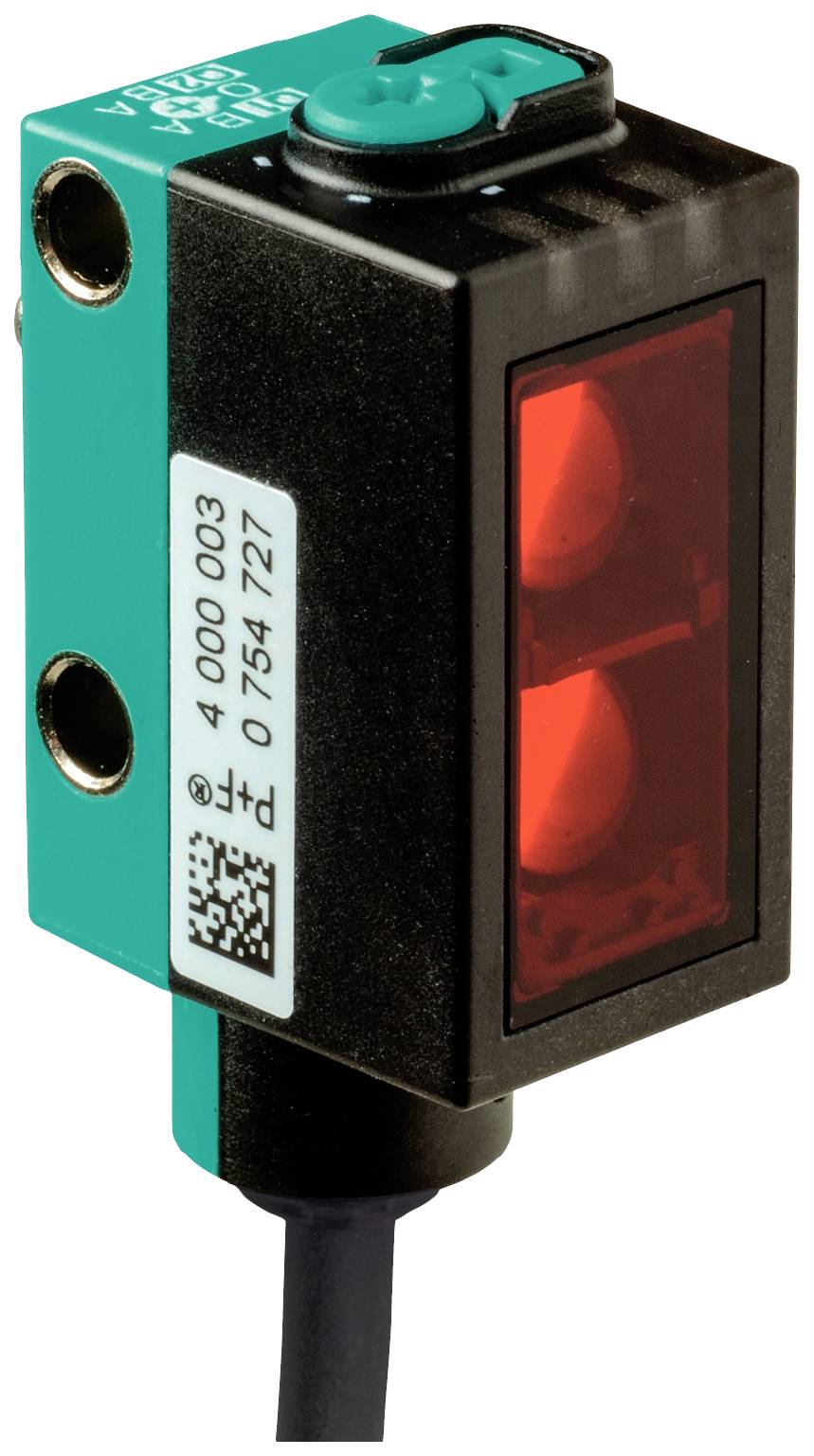 Ein rechteckiger, elektronischer Sensor mit grünem Gehäuse, roter Leuchtanzeige und schwarzen Kabelanschlüssen. Wird zur Objekterkennung verwendet.