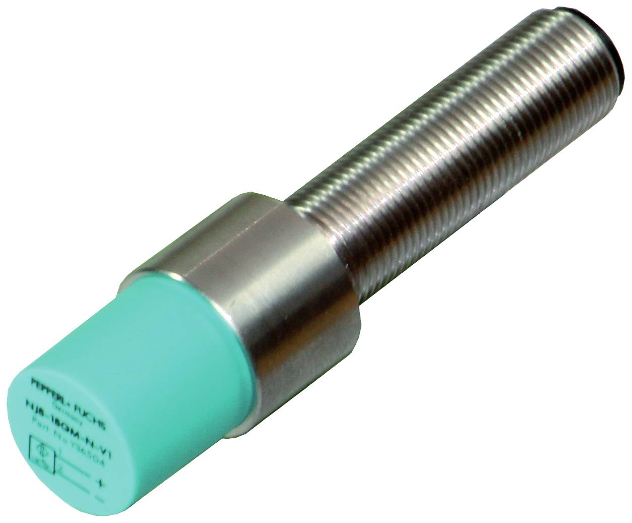 Zylindrischer, silberner Sensor mit grünem Kopf. Wird verwendet, um Objekte in der Nähe zu erkennen.