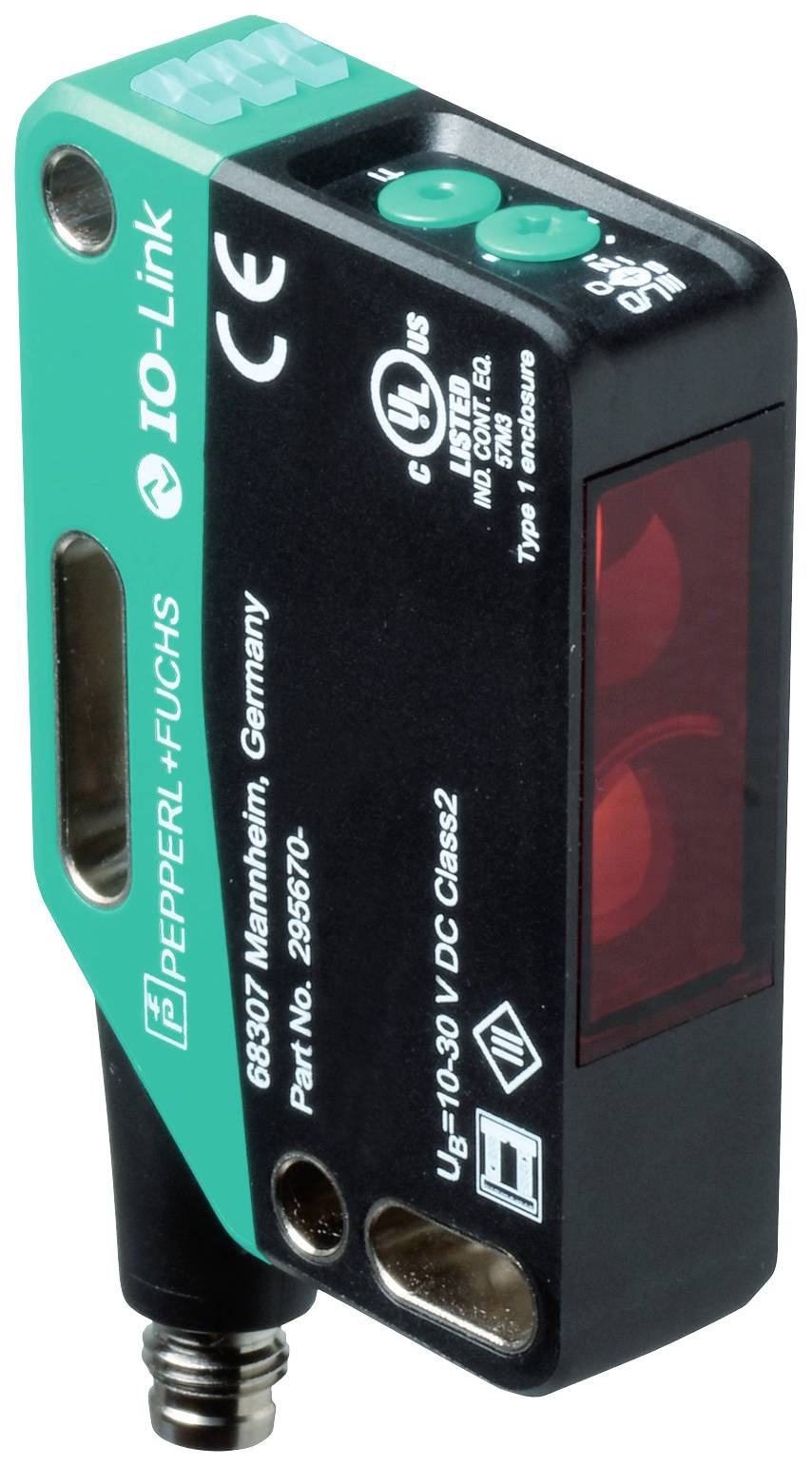 Kompakter optoelektronischer Sensor mit IO-Link-Technologie von Pepperl+Fuchs, teilweise grünem Gehäuse und technischen Markierungen.