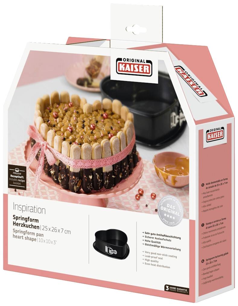 Herzförmige Springform von Kaiser Original, abgebildet mit dekoriertem Kuchen. Verpackung in Rosa mit Produktinformationen.