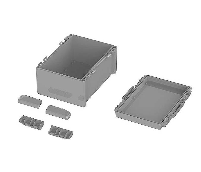 Ein rechteckiger grauer Behälter mit abnehmbaren Deckel, daneben drei kleine rechteckige Teile.