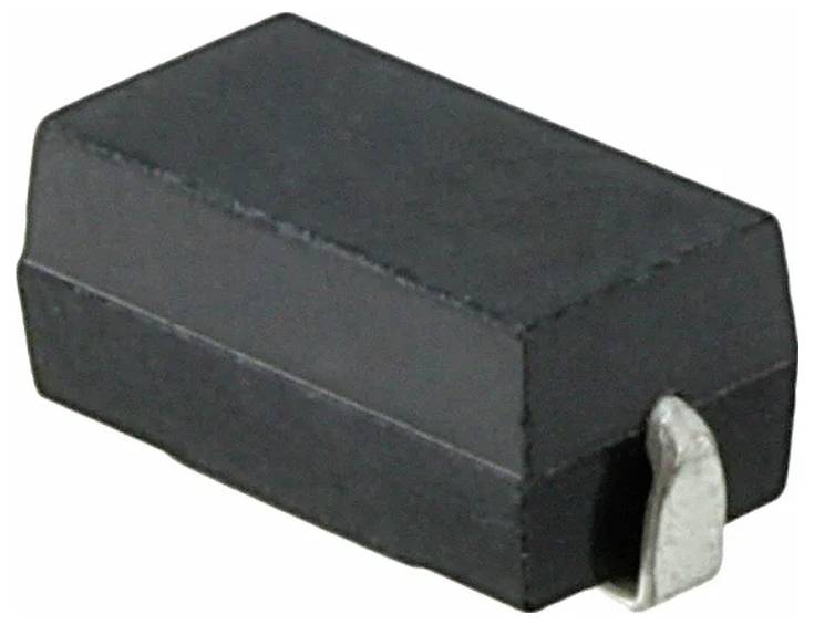 Eine schwarze rechteckige elektronische Komponente mit Metallanschluss auf einer Seite, vermutlich ein oberflächenmontierter Halbleiter oder eine Diode.