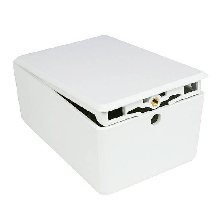 Weiße Abdeckung für Aufputz-Kabelmanagement, öffnet sich von oben, mit runder Öffnung an der Vorderseite für Kabeldurchführung.