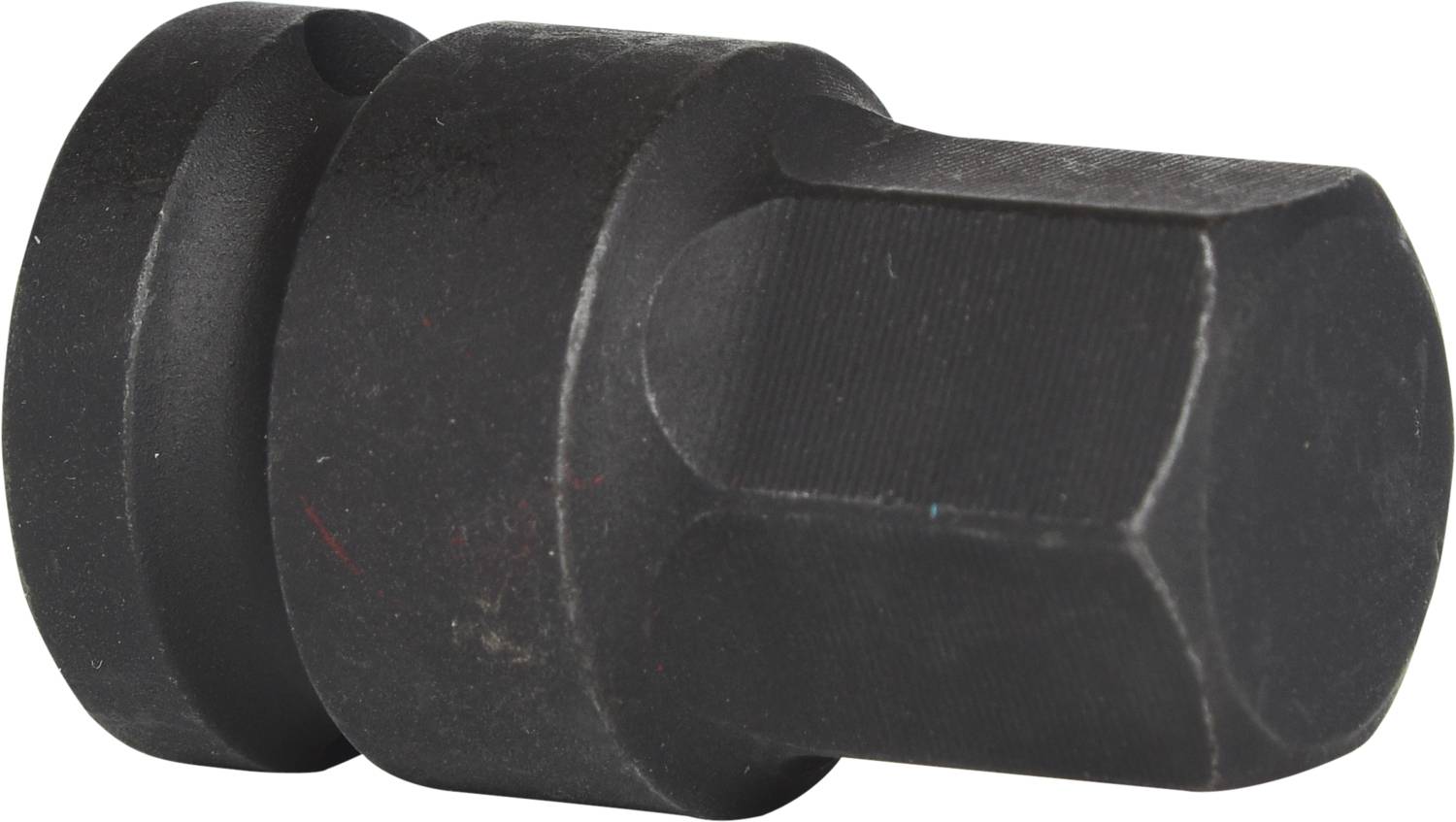 Ein schwarzer, sechskantiger Metallaufsatz für Werkzeuge, möglicherweise ein Adapter oder Aufsatz für Schraubarbeiten.