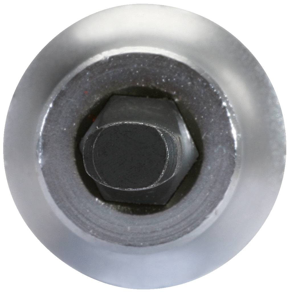 Nahaufnahme einer silbernen Schraubmutter in einem Metallgehäuse.