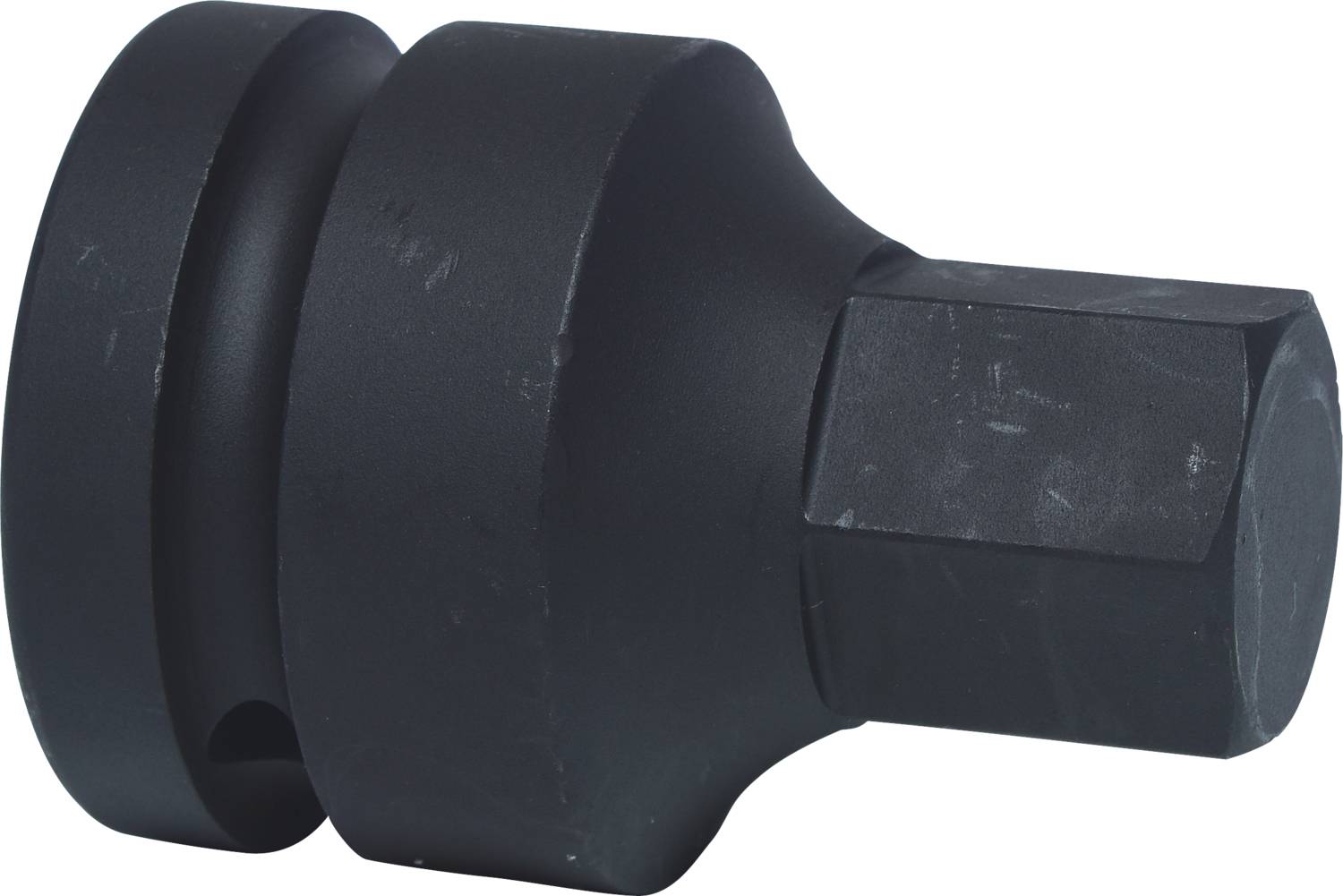 Schwarzes, rundes Werkzeug mit sechskantigem Ende, vermutlich Adapter oder Einsatz für mechanische Arbeiten.