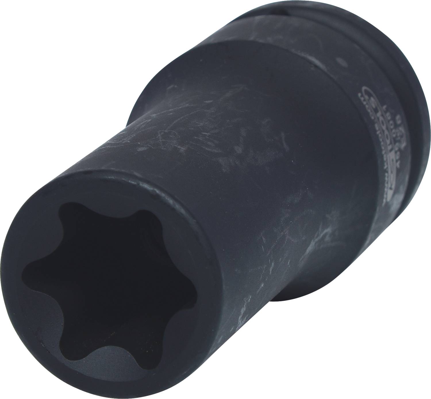 Schwarzes, zylindrisches Werkzeug mit sternförmiger Öffnung an einem Ende, leicht gebraucht.