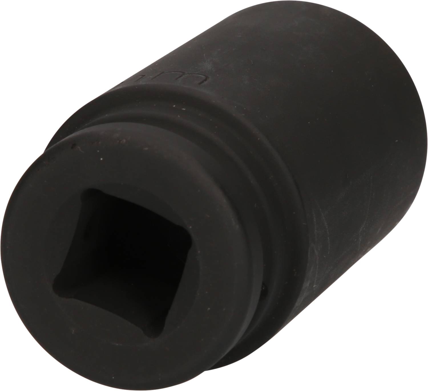 Ein schwarzes Zylinderelement aus Gummi mit einer quadratischen Öffnung und geriffelter Seite. Könnte ein Dämpfungselement sein.