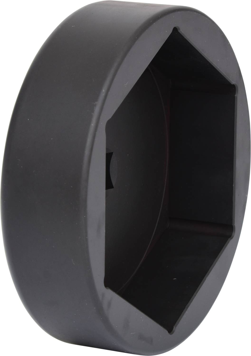 Ein schwarzes, sechseckiges Objekt mit einer glatten Oberfläche, wahrscheinlich ein Werkzeug oder eine Abdeckung.