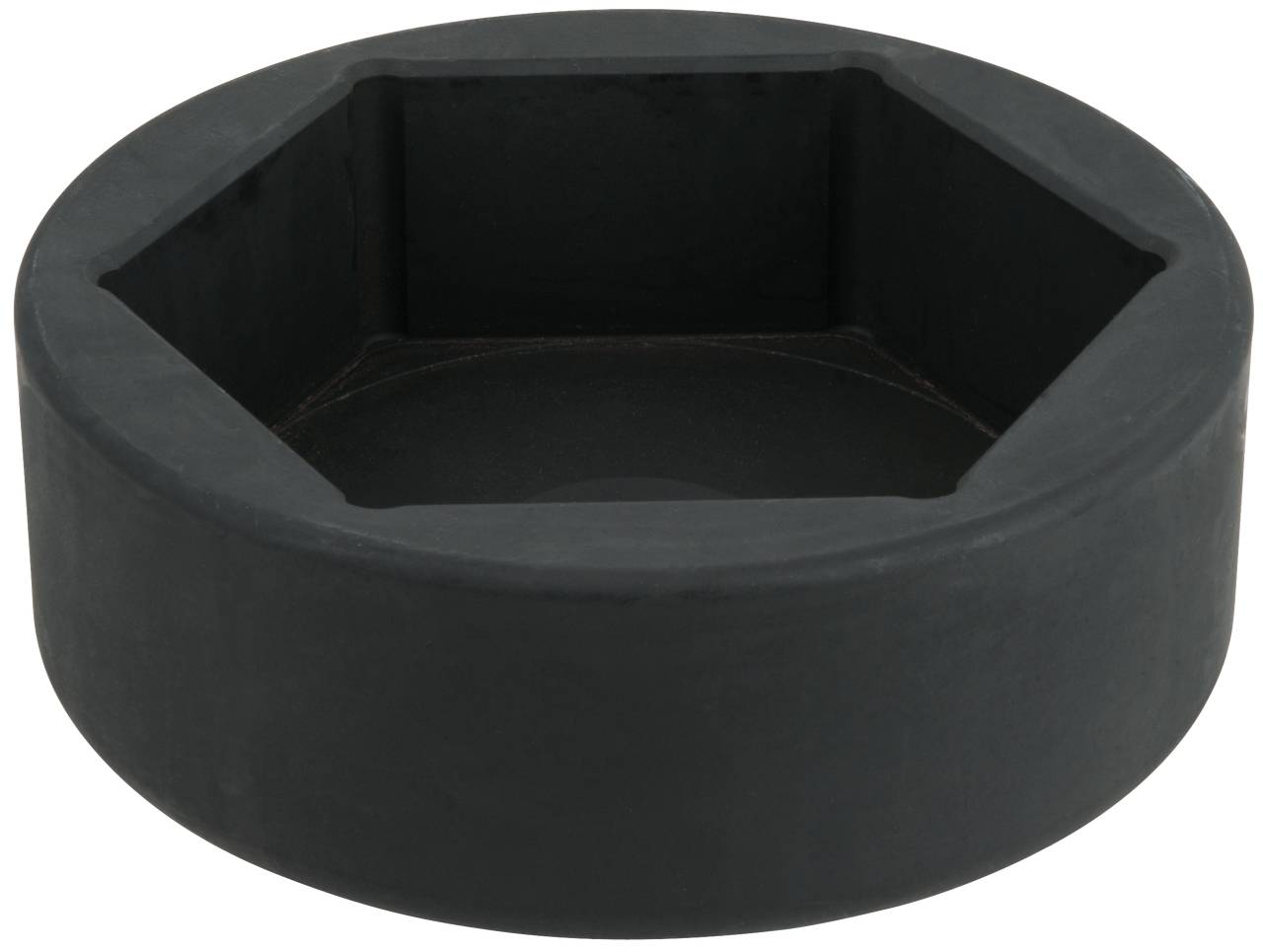 Ein großes, sechseckiges schwarzes Bauteil oder Werkzeug aus Metall mit hohlem Innenraum.