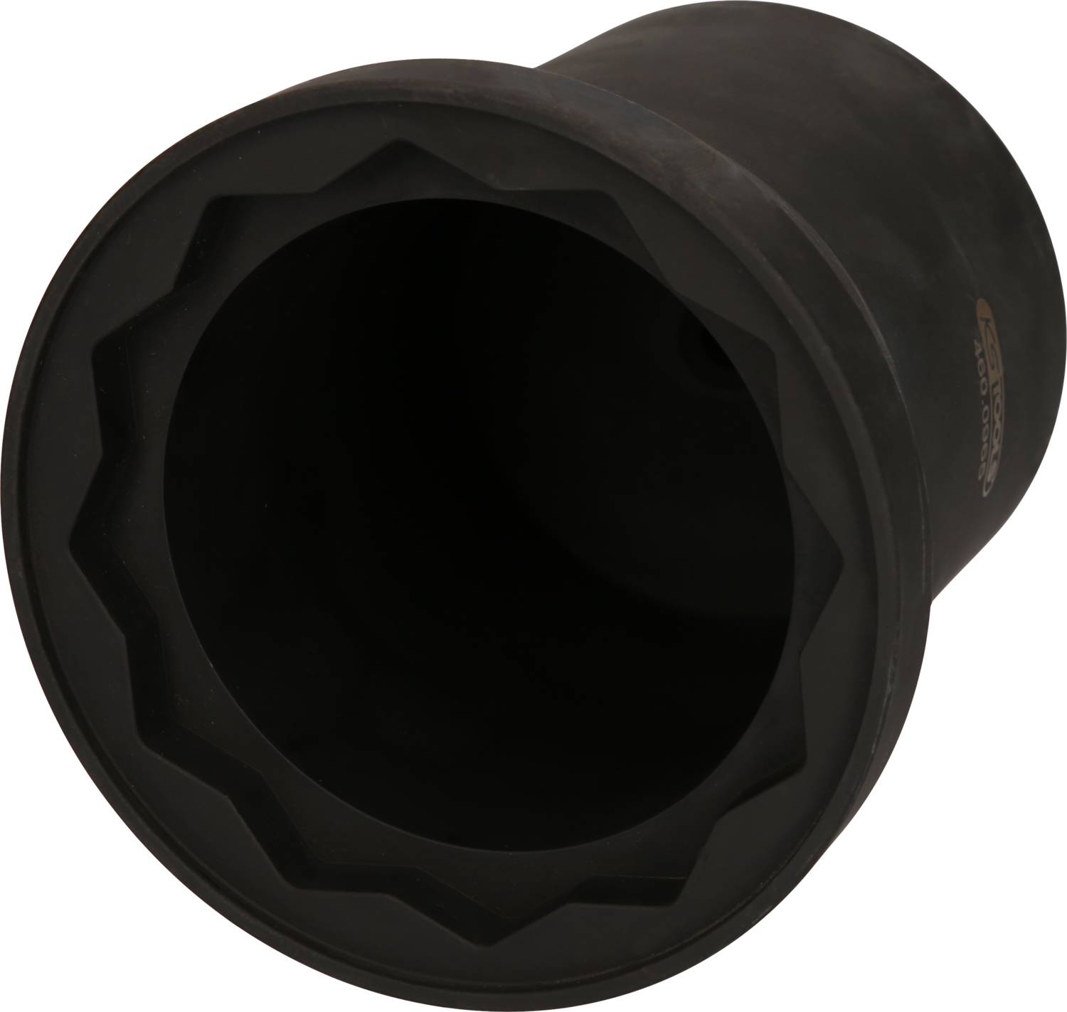 Schwarzes, zylindrisches Objekt mit gezacktem Rand in Nahaufnahme.