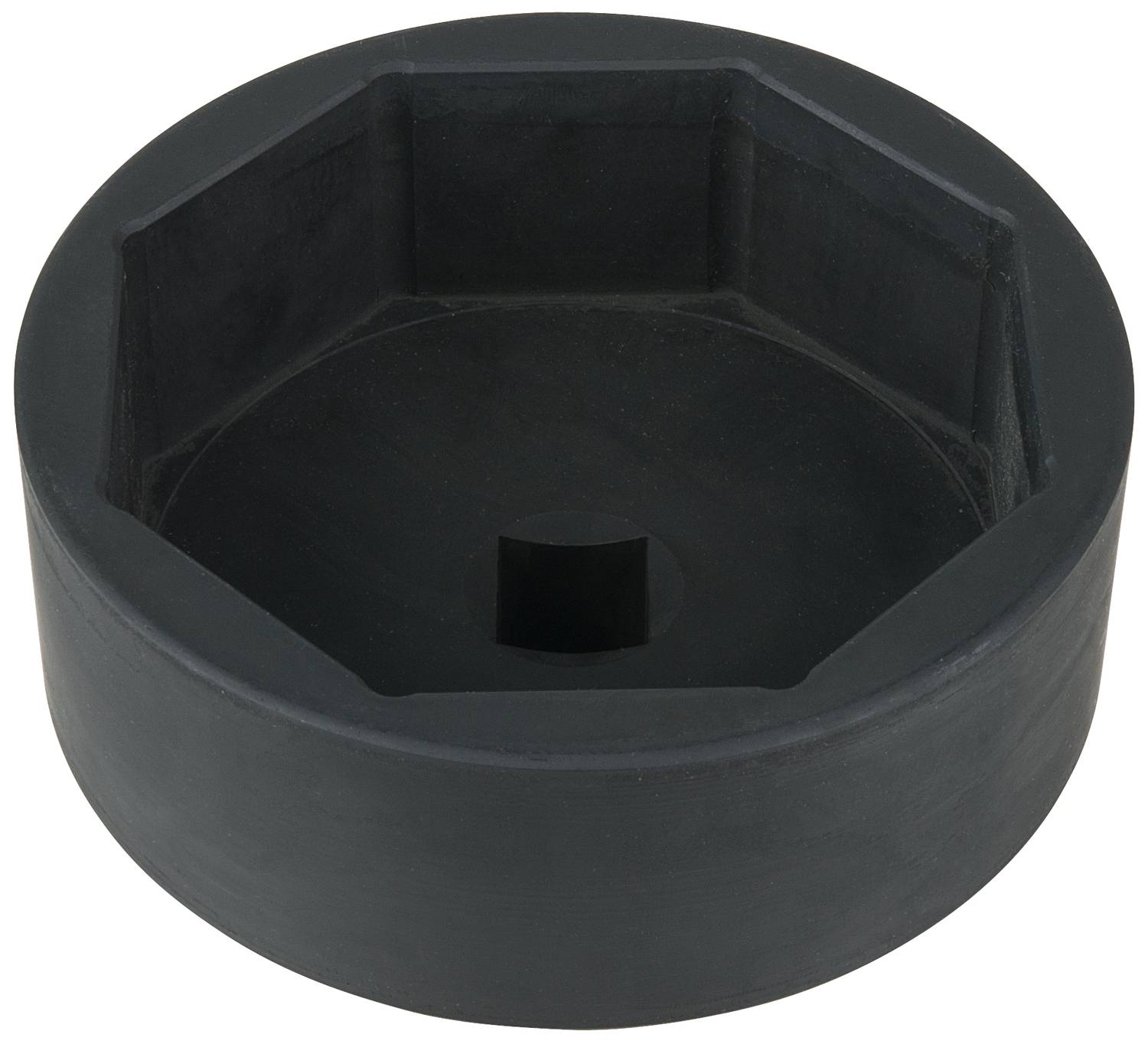Schwarzes, sechseckiges Werkzeugteil mit zentraler quadratischer Öffnung, vermutlich eine große Schrauben- oder Mutterabdeckung.