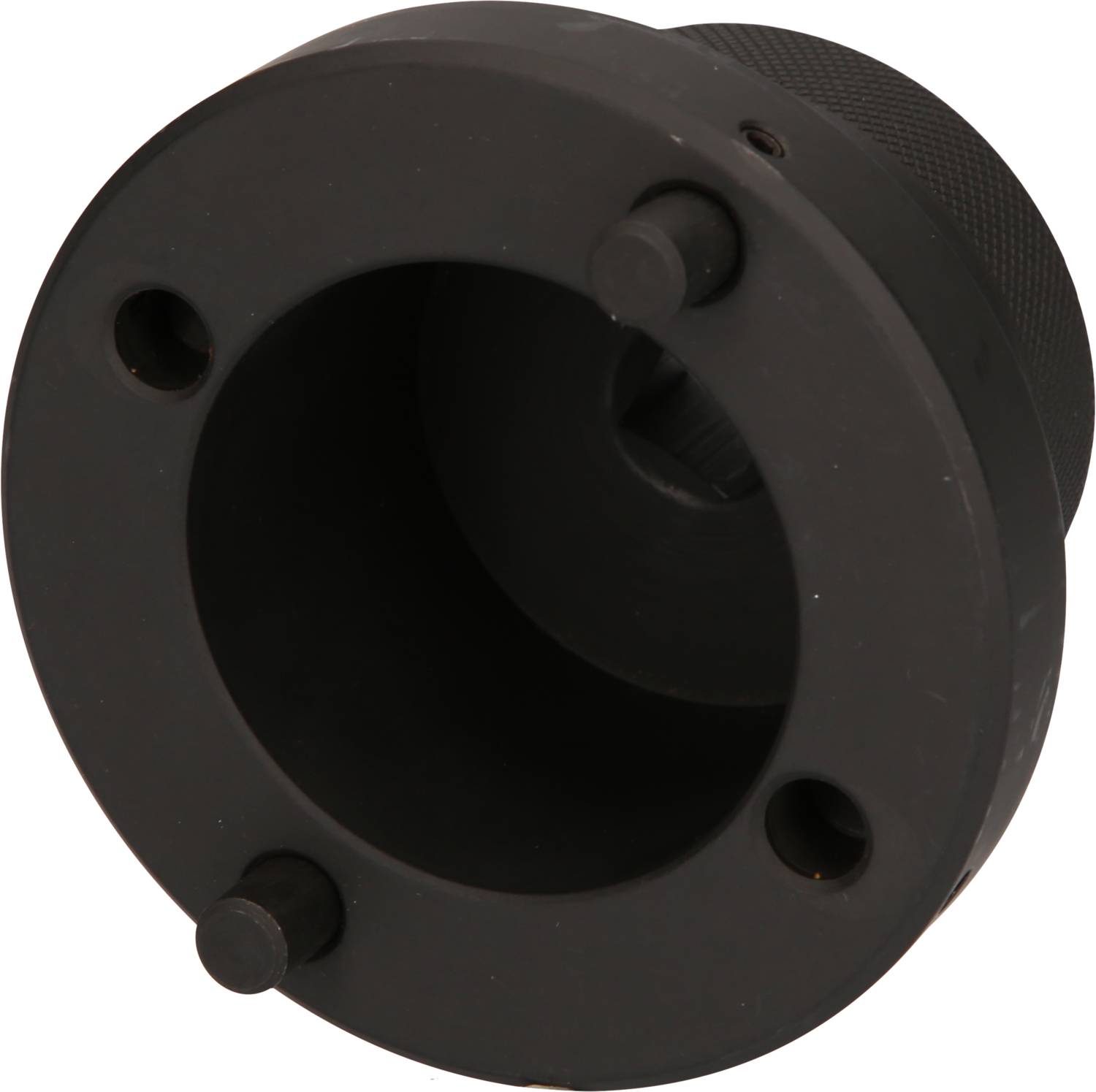 Ein schwarzes, zylindrisches Bauteil mit drei hervorstehenden Stiften, vermutlich ein technisches Teil oder Werkzeug.