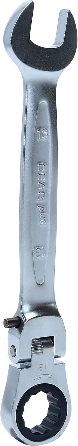 Ein silberner Ratschenschlüssel, der in einer Werkstatt verwendet wird. Der Schlüssel hat offene und ringförmige Enden für verschiedene Schrauben.