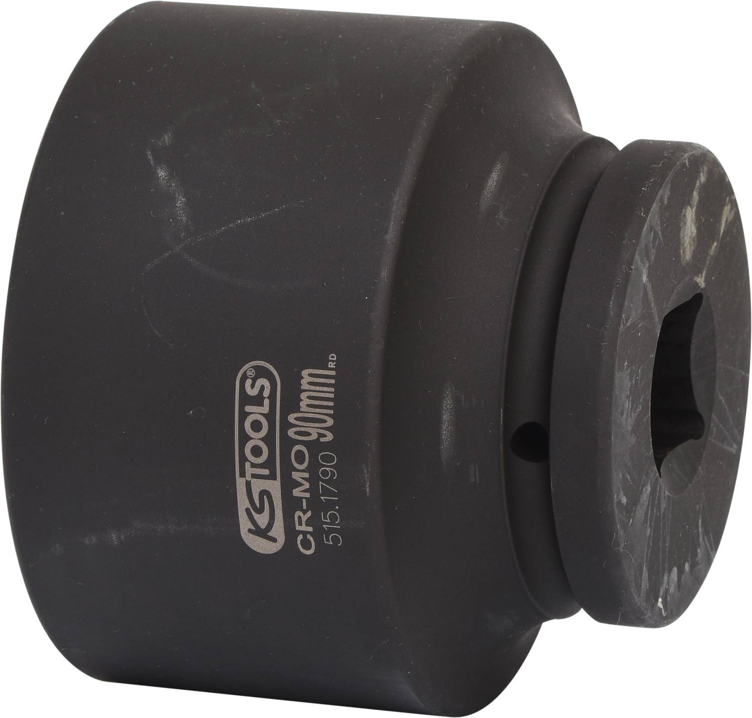 Ein runder Steckschlüsseleinsatz aus schwarzem Metall, 90 mm, mit der Aufschrift 'KS Tools CR-MO 90 mm'.