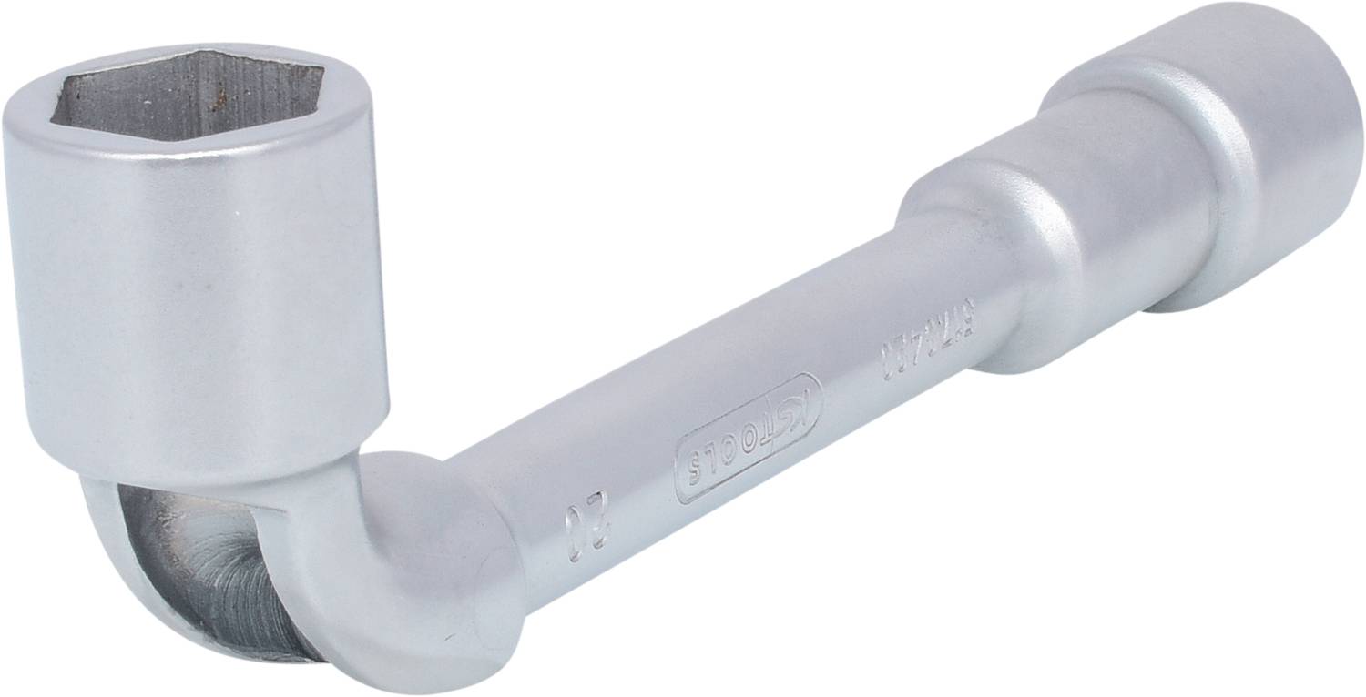 Ein silberner Winkelschlüssel, der an einem Ende hexagonal ist, liegt auf einer weißen Oberfläche. Er wird für mechanische Arbeiten verwendet.