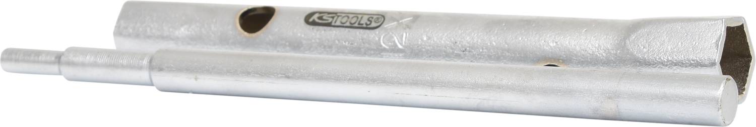 Silbernes mechanisches Werkzeug in zylindrischer Form mit zwei Teilen, Löchern und einer Prägung mit der Aufschrift 'ASTAHLS'.