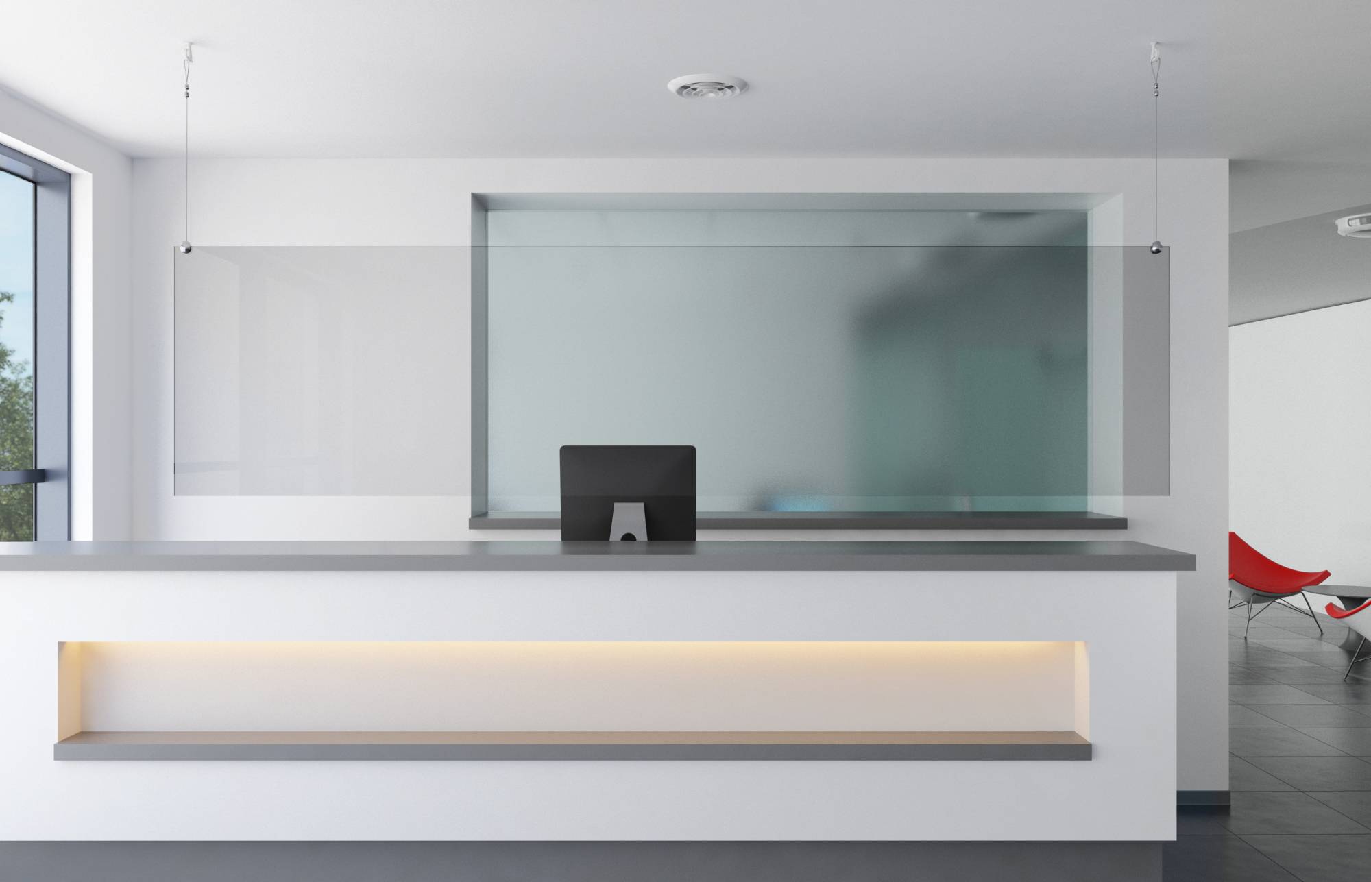 Ein moderner, minimalistischer Empfangstisch mit einem Computerbildschirm, transparenter Plexiglaswand und Umgebungsbeleuchtung. Ein roter Stuhl befindet sich im Hintergrund.